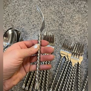 8 setting silverware set with two butter knives.